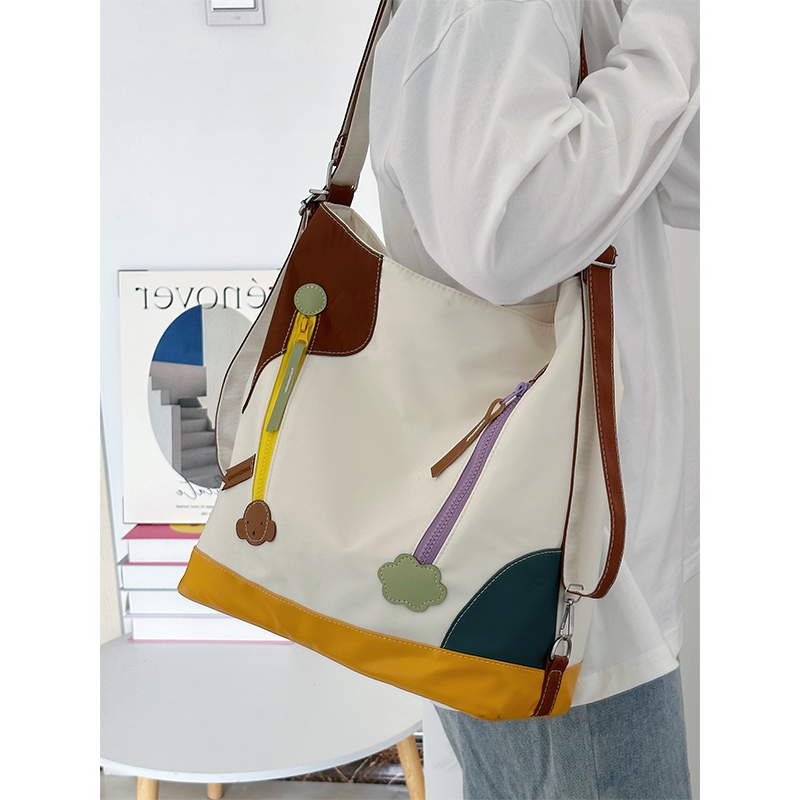 双肩斜挎两用包女士高颜值单肩包帆布袋外出旅行包小众设计感背包