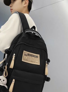 最新款简约旅行电脑背包休闲纯色标签双肩初高中生大容量书包