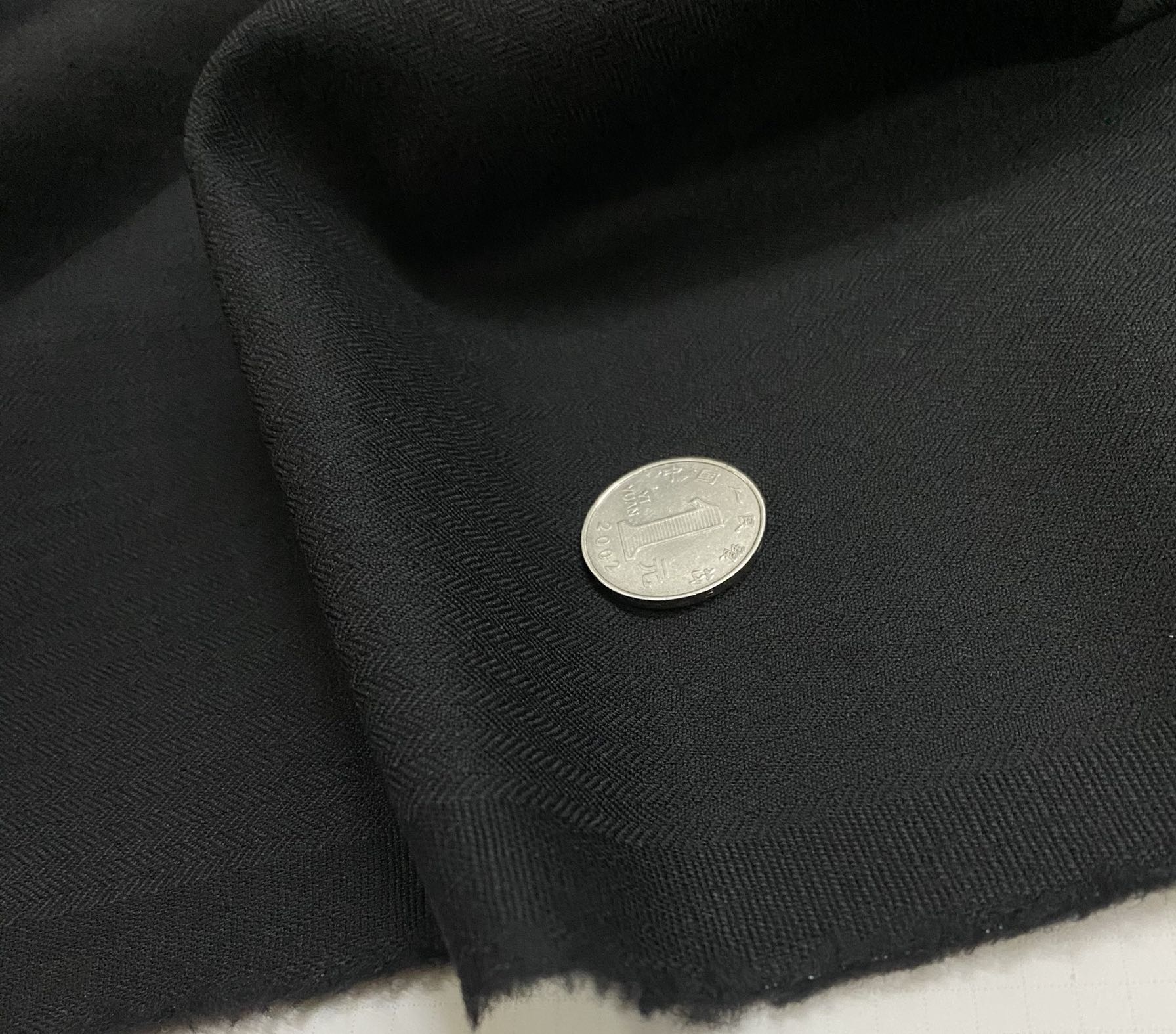 意大利进口加厚纯黑色暗人字纹肌理精纺全羊毛面料设计师西装布料